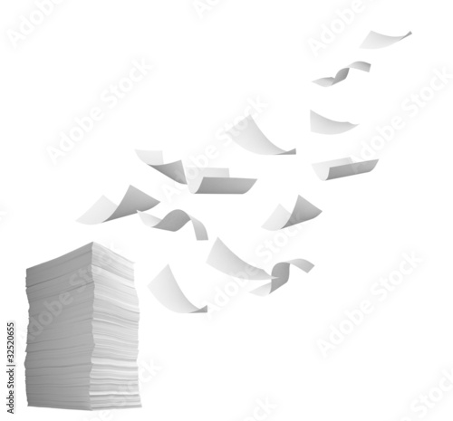 Photo: stack of papers and curl paper flying in wind office business stack of papers and curl paper flying in wind office business
