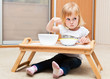 A small girl is eating