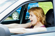 A scared woman behind the wheel