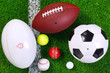 Foto: Sports balls on grass from above. Sports balls on grass from above.