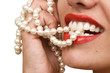 Photo: woman smiles showing white teeth and pearly necklace woman smiles showing white teeth and pearly necklace