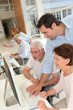 Photo: Group of senior people in business training Group of senior people in business training