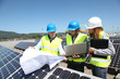 Photo: Group of engineers meeting on building roof Group of engineers meeting on building roof