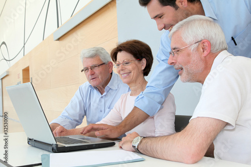 Photo: Group of senior people attending job search meeting Group of senior people attending job search meeting