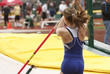 Photo: Female athlete competing in the pole vault Female athlete competing in the pole vault