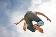 Man jumping against blue sky