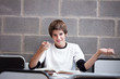 Impish schoolboy in classroom
