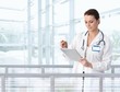 Foto: Female doctor using tablet in hospital Female doctor using tablet in hospital