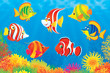 colorful tropical fish swimming above a coral reef