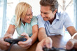 Mature couple playing video game