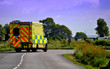 Ambulance on a country lane approaching a bend