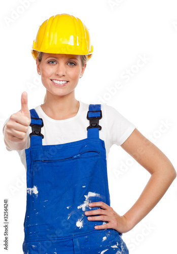 Foto: junge handwerkerin zeigt daumen hoch junge handwerkerin zeigt daumen hoch