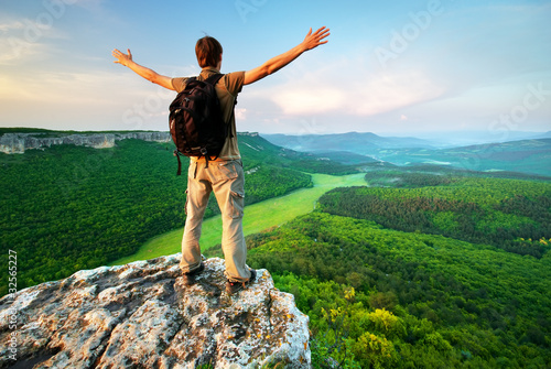 Photo: Man on top of mountain Man on top of mountain