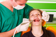 Foto: A young male dentist working A young male dentist working