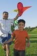 Father And Son At The Park With A Kite