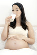 Pregnant woman drinking milk
