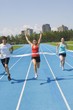 Photo: Runners On A Race Track At Finish Line Runners On A Race Track At Finish Line