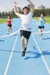 Photo: Runners On A Race Track At Finish Line Runners On A Race Track At Finish Line