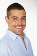 Foto: Portrait of smiling young man on white background Portrait of smiling young man on white background