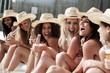 Happy young females having beer at the beach, laughing