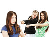 Two girls making fun of a girl Two girls making fun of a girl