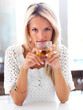 Beautiful young female holding a drink