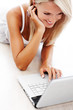 Portrait of beautiful young woman using laptop