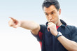 Football referee blowing whistle and pointing finger