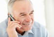 An elderly man talking over the mobile phone