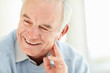 Closeup of a smiling mature man looking away