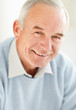 Closeup of a senior mature man giving you a cute smile