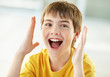 Foto: Closeup of a cheerful little boy shouting Closeup of a cheerful little boy shouting