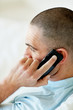 Side view of a middle aged male over the cellphone