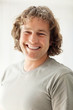 Middle aged happy man against white background