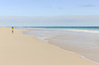 Woman jogging along the Pink Sands Beach on Harbour Island