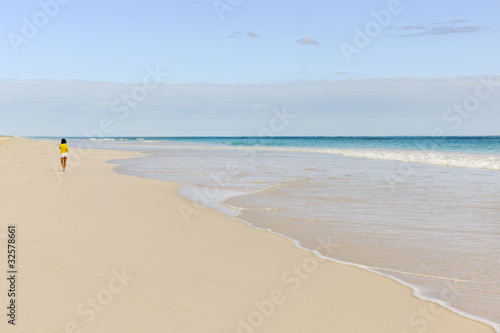 Photo: Woman jogging along the Pink Sands Beach on Harbour Island Woman jogging along the Pink Sands Beach on Harbour Island