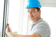 Happy young construction worker with hard helmet