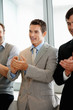 Business team clapping for a good presentation in office