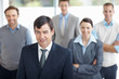 Middle aged business man with his colleague in background