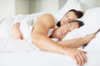 Photo: Attractive young couple sleeping together Attractive young couple sleeping together