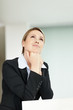 Young business woman looking up at your text