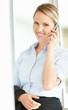Young female executive talking on a mobile phone