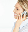 Side view of a happy young girl using cellphone with copyspace