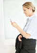 Side view of a happy business executive reading an SMS