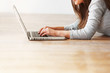 Photo: Relaxed middle aged woman working on laptop with copyspace Relaxed middle aged woman working on laptop with copyspace