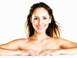 Smiling naked female against white background