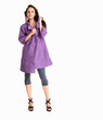 Foto: Young female wearing winter coat against white - copyspace Young female wearing winter coat against white - copyspace