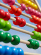 Close-up of a coloured children abacus in front of blue sky