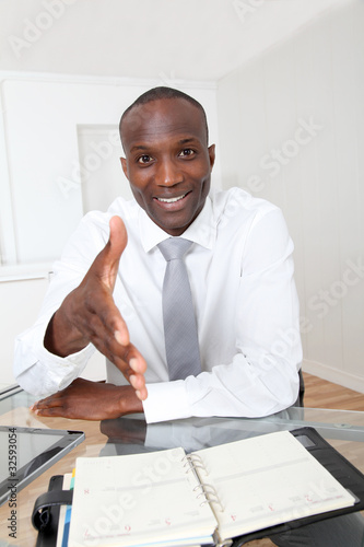 Photo: Businessman in office for an interview Businessman in office for an interview