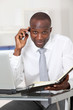 Businessman talking on the phone in office
